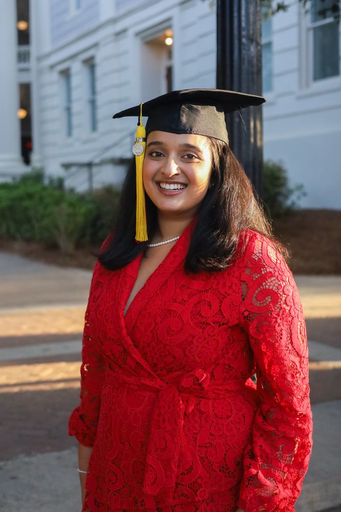 Close portrait of a smiling graduate in cap and gown